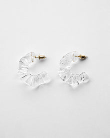 Gold‑plated stud earrings with layered sheets of transparent glass draped like ice over branches, etched with fine lines that sparkle in the light.