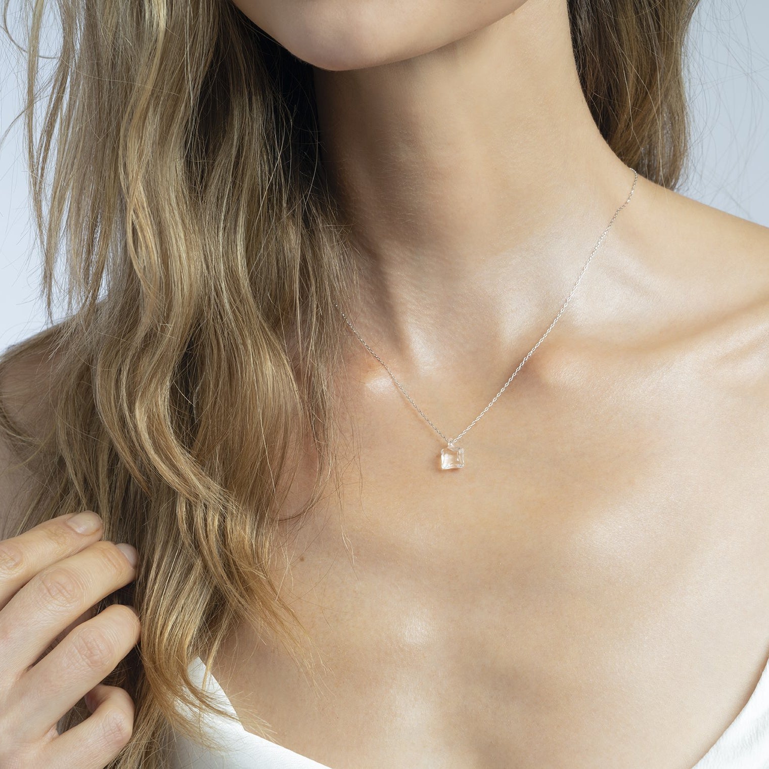 A model is wearing Moonlight necklace.