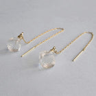 Softly shaped glass cube earrings that feature contrasting frosted and polished surfaces. Handmade melted-look glass cube earrings attached to slender gold-plated chains designed to be threaded through the piercing.