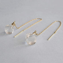 Softly shaped glass cube earrings that feature contrasting frosted and polished surfaces. Handmade melted-look glass cube earrings attached to slender gold-plated chains designed to be threaded through the piercing.