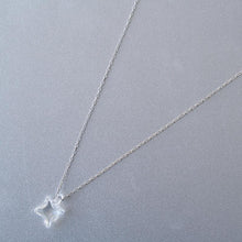 A soft square handmade glass pendant that glows like moonlight, attached to a 470mm silver necklace chain.