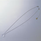 A soft square handmade glass pendant that glows like moonlight, attached to a 470mm silver necklace chain.