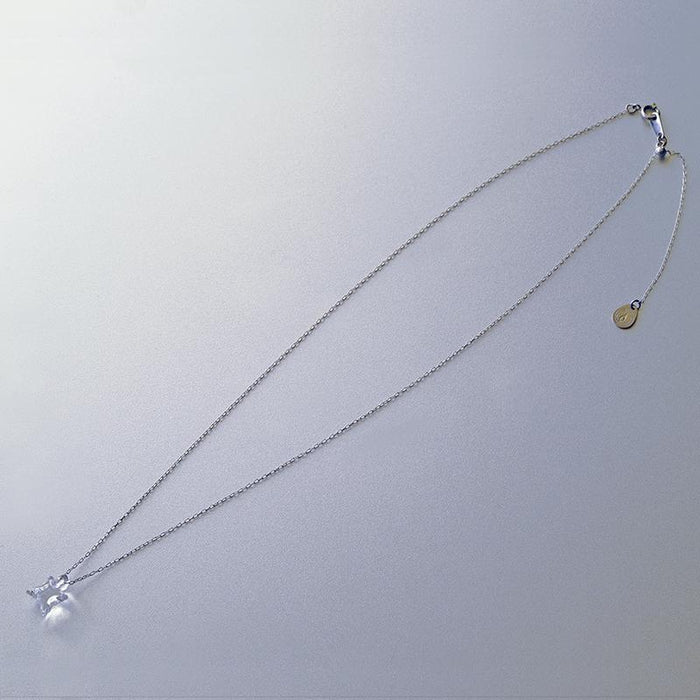 A soft square handmade glass pendant that glows like moonlight, attached to a 470mm silver necklace chain.