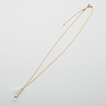 A handmade glass lily pendant with one flower and one bud, suspended from an adjustable gold‑plated chain.